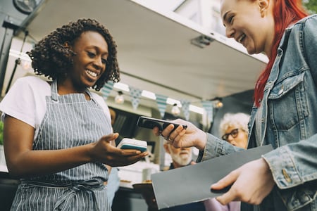 Store manager displaying positive nonverbal communication in customer service