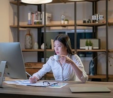 person working on a computer at a desk