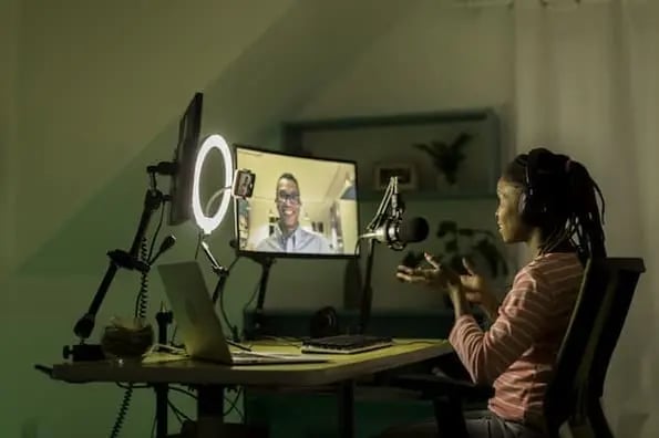 podcast host uses podcast equipment to conduct interview