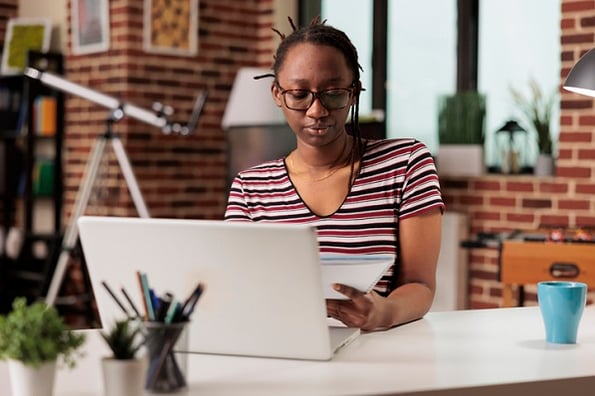 Young woman discovering how she can use Python literals to improve her software programming code.