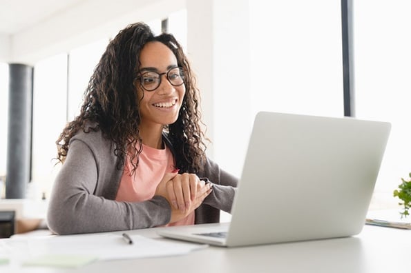 A young woman discovers how to typecast string values to integer values in the Python programming language.