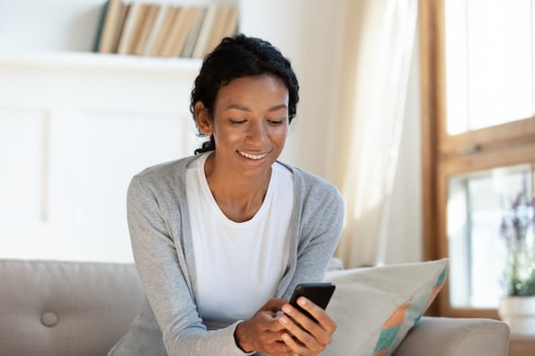 Home buyer watching a real estate video on their phone