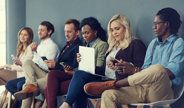 recruitment team studying hiring trends for upcoming talent search in 2023