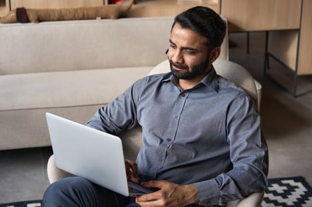 customer retention specialist working on his laptop