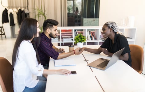 service rep practicing customer intimacy shaking hands with clients