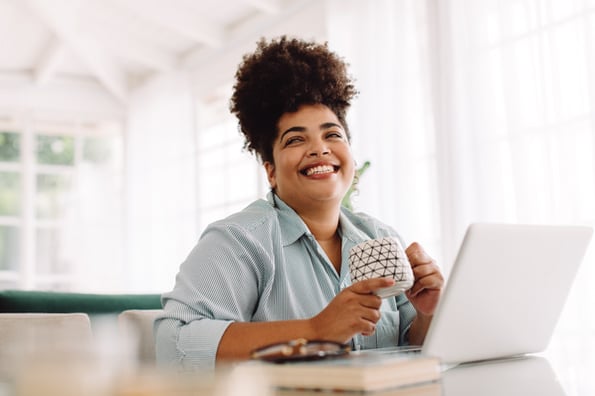 Person smiling because they're avoiding site performance challenges 