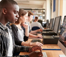 people using computers in an office