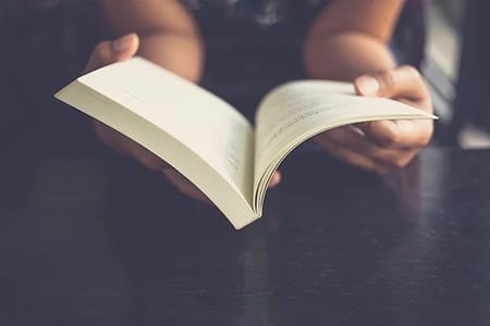 storytelling brain: person holding a book open