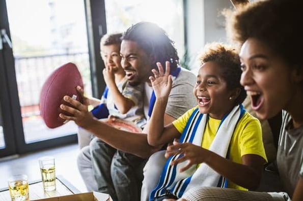 A family of consumers watch their favorite Super Bowl ads.