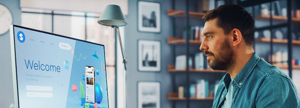 person using a computer in a home office