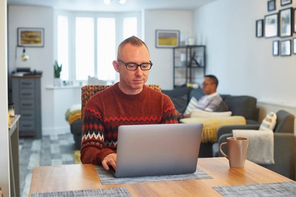 Man with visual impairment reading article on website accessibility for blind folks 