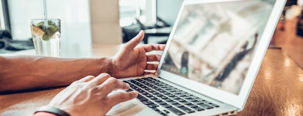 close-up of hands uding a laptop