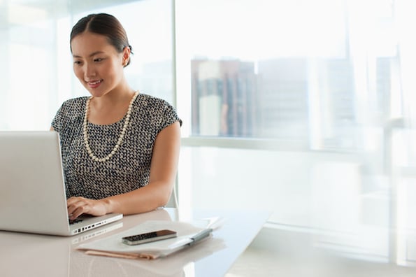 Businesswoman going through her website redesign checklist to make sure she ticked all the boxes