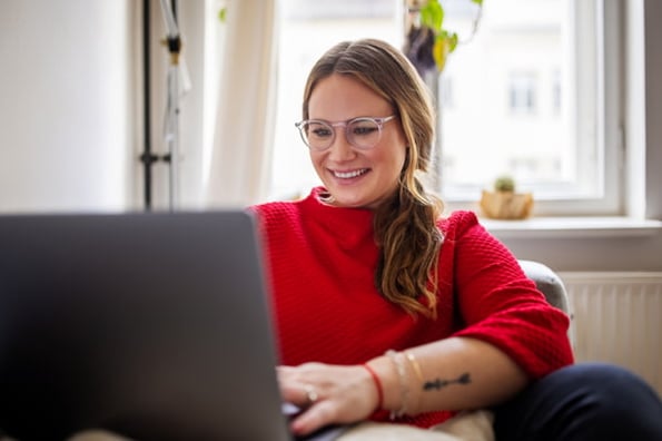 Person wondering 'What does it cost to redesign a website in 2022?' 