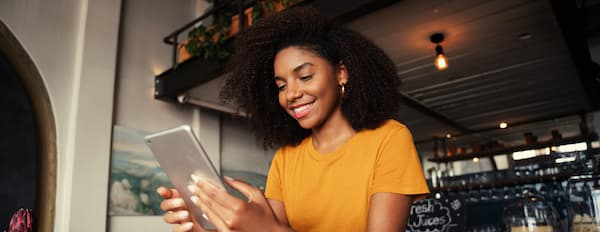 woman looks at her smartphone