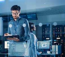 person using a digital tablet in an office