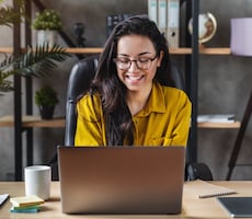 person using a laptop in a home office