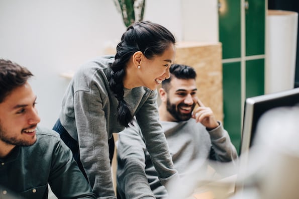 two people looking at wordpress enterprise hosting providers in an office